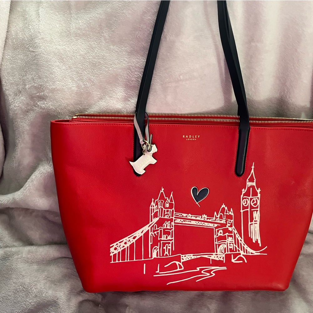 Radley of London tote with zipper top. 18”W x5”Depth x 11”H handles are 10”